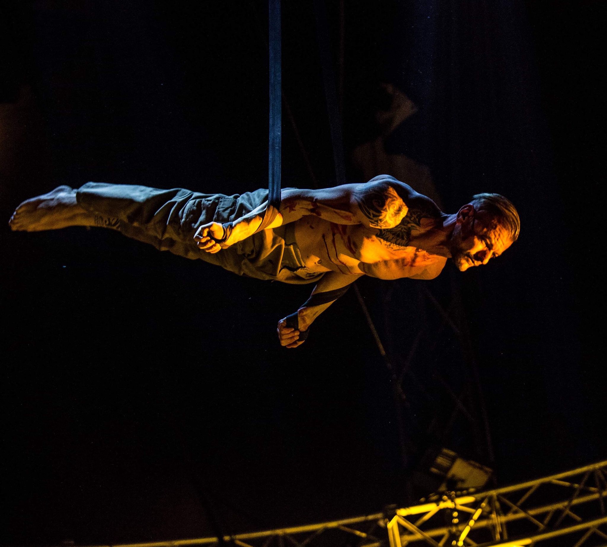 Circus Bellucci performance with dramatic lighting